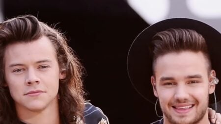 Harry Styles and Liam Payne smiling together in a photo.