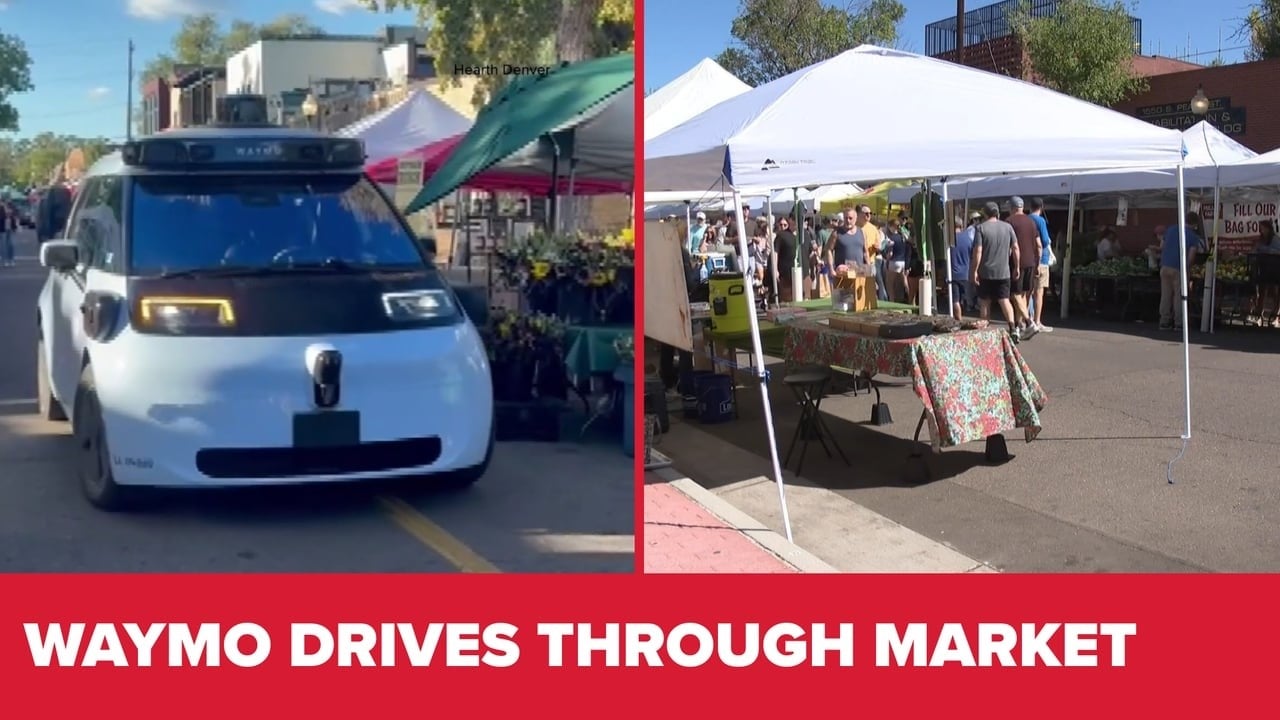Waymo passes barricades at Denver farmers market during setup