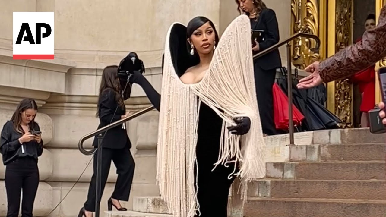Cardi B holds a live crow at Schiaparelli's show at Paris Fashion Week