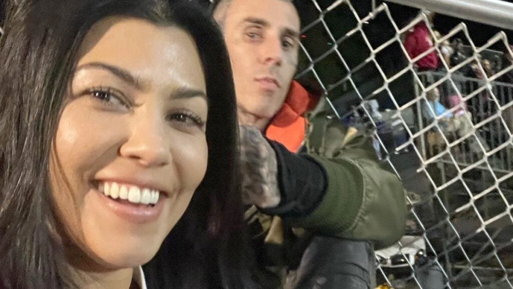 Kourtney Kardashian and Travis Barker smiling