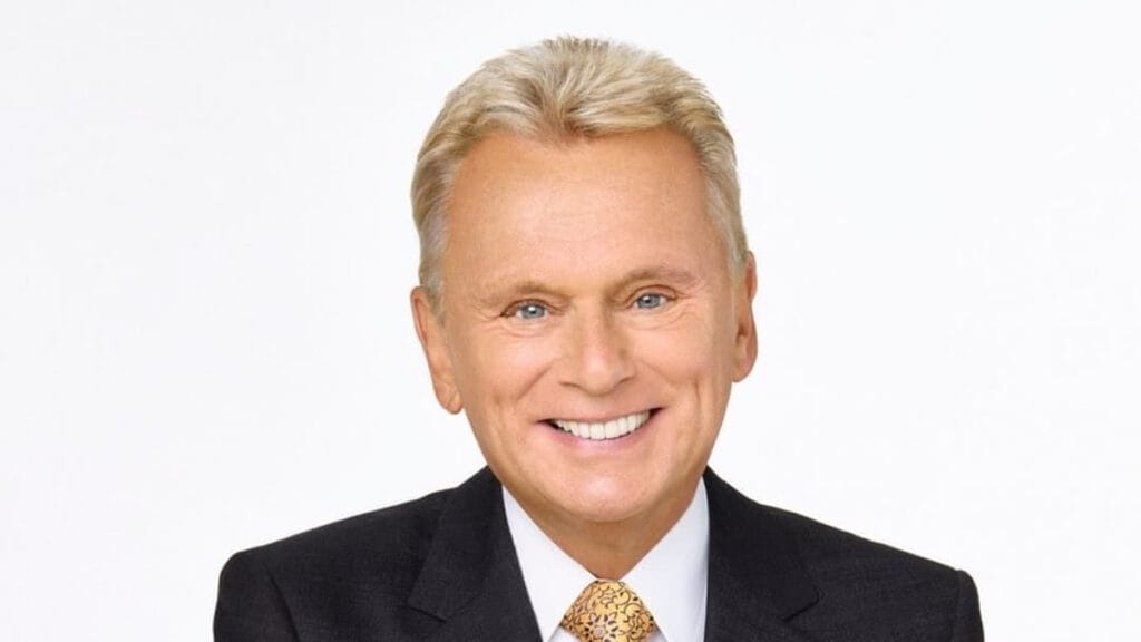 Wheel of Fortune Host Sajak, Pat Sajak and contestant