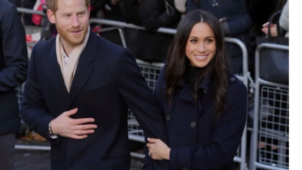 Meghan Markle Worries Prince Harry Is Naive About Reconciliation With Prince William Prince Harry and Meghan Markle holding hands during a public appearance.