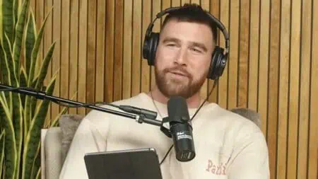 Travis Kelce shows off longer hair sans Taylor Swift.