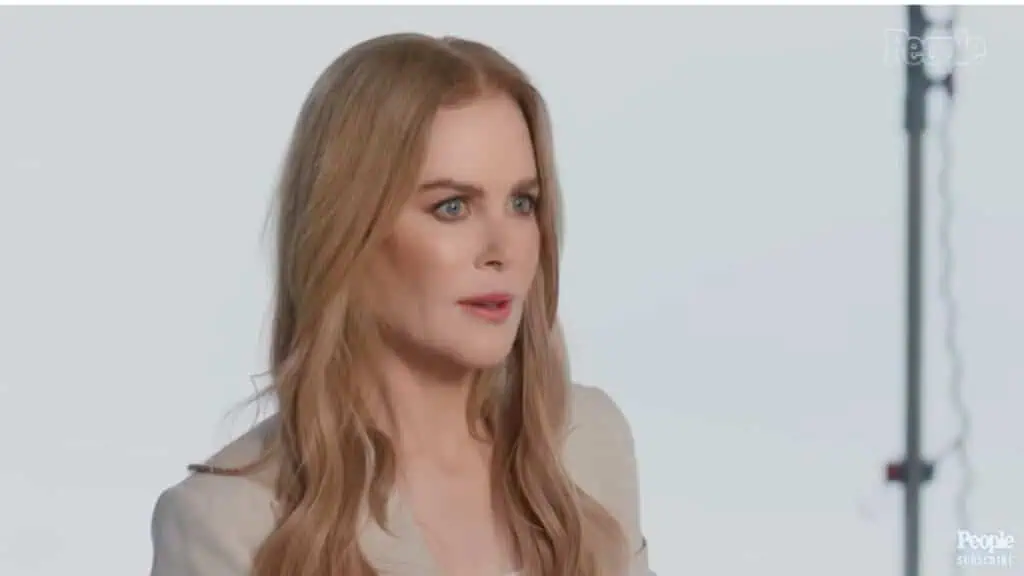 Nicole Kidman dressed in white, gives an interview discussing life with her husband and kids.