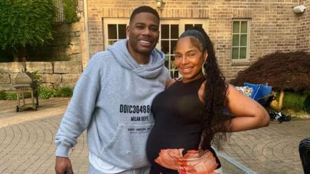 Pregnant Ashanti posing with her fiancé Nelly