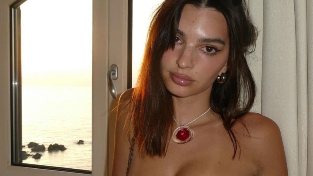 Emily Ratajkowski posing in strapless dress