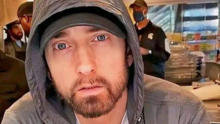 Eminem Shows He ‘Always Dresses Like He’s About To Rob A Bank’ Eminem poses close up