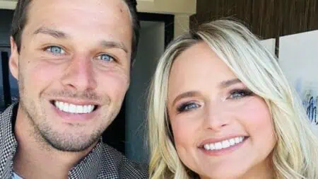 Miranda Lambert and husband Brendan McLoughlin pose for a photo.