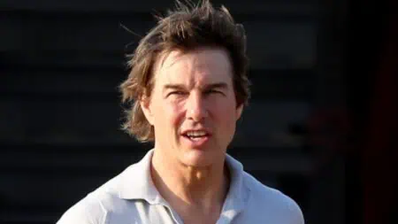 Tom Cruise seen with the wind blowing in his hair as he arrives at London's Battersea Heliport