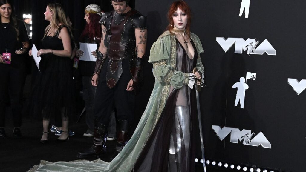 Chappell Roan Channels Her Best Henry Cavill With Ultra Revealing Antique Witcher-esque Dress and Matching Sword At the VMAs