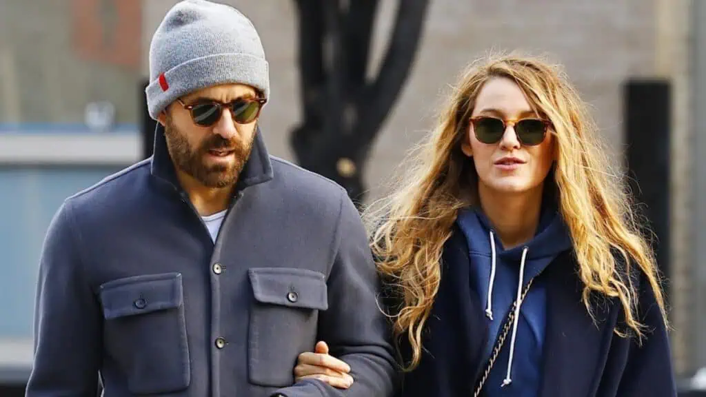 Blake Lively holds Ryan Reynolds arm as they take a stroll in New York City.