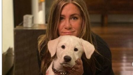 Jennifer Aniston poses with one of her dogs in an Instagram photo.