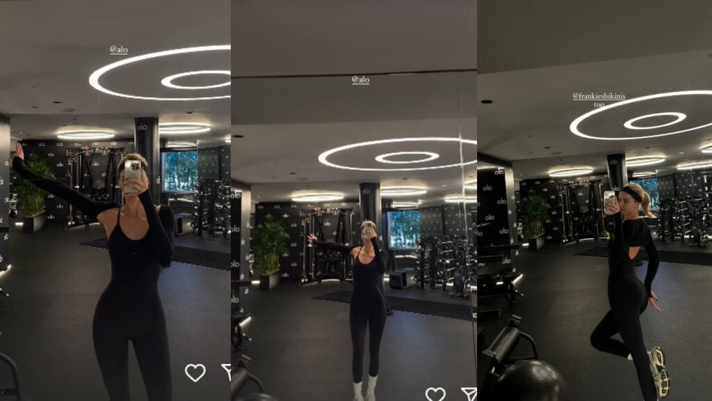 Kendall Jenner at the gym in a black catsuit and crop jacket.