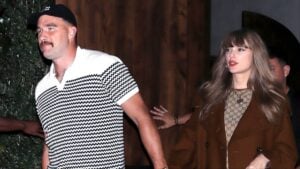 Travis Kelce and Taylor Swift holding hands