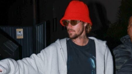 Justin Bieber wears hat and sunglasses during outing.