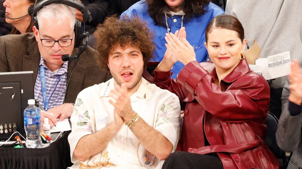 How ‘Chivalrous’ Benny Blanco Keeps Romance With ‘Best Friend’ Selena Gomez Thriving: ‘I Go All Out’ Selena Gomez and Benny Blanco share a moment as they sit on celebrity row during the first quarter of the Philadelphia 76ers vs. New York Knicks game at Madison Square Garden. 22 Apr 2024