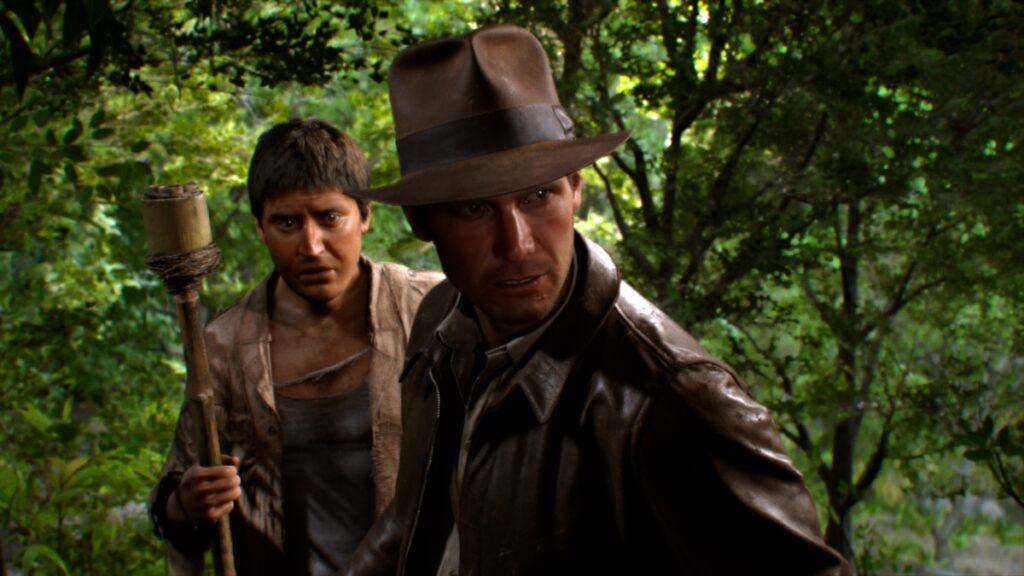 Indy and his companion walk through the jungle in Indiana Jones and the Great Circle