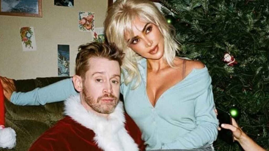 Kim Kardashian Sits On Macaulay Culkin’s Lap In Steamy Christmas Photo: ‘Someone Call Brenda Song’ Kim Kardashian and Macaulay Culkin