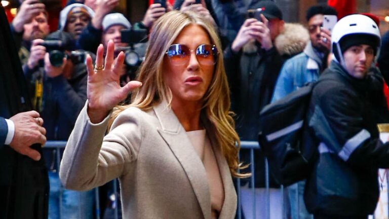 Jennifer Aniston Begs Brad Pitt To ‘Break Up’ With Girlfriend As Reunion Romance Surface: ‘Things Could’ve Been Very Different’ Jennifer Aniston waving