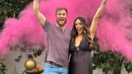 Kristen Doute Blasts Lisa Vanderpump as a Clown for Questioning Her Pregnancy Kristen Doute and Luke Broderick in front of pink dust.
