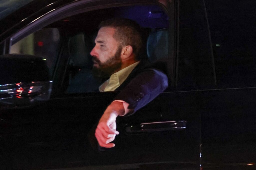 Los Angeles, CA - *EXCLUSIVE* - Actor Ben Affleck opens his eyes wide in shock while driving home from his office to see the huge wild fire burning across the street from where he lives in Los Angeles.