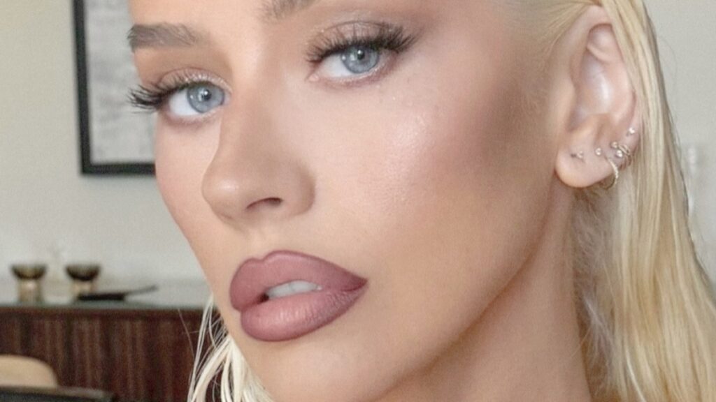 Christina Aguilera’s ‘Ozempic’ Body Sparks ‘Hunger Games’ Comments In Plunging Shirt Christina Aguilera close up