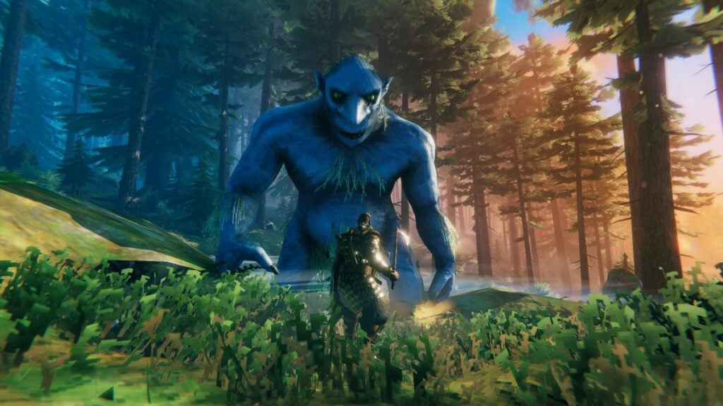 A viking faces off against a towering blue monster in a forest in Valheim