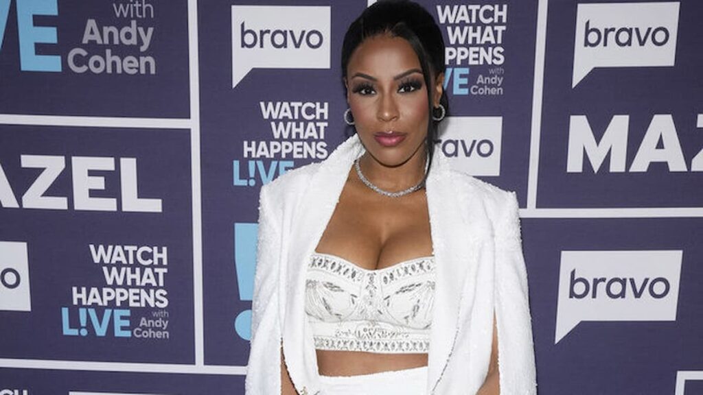 RHODubai’s Caroline Brooks Slams Her Co-Stars After Bravo Puts Show on Pause: ‘This Cast Wasn’t Really Friends’ Caroline Brooks posing on WWHL red carpet.