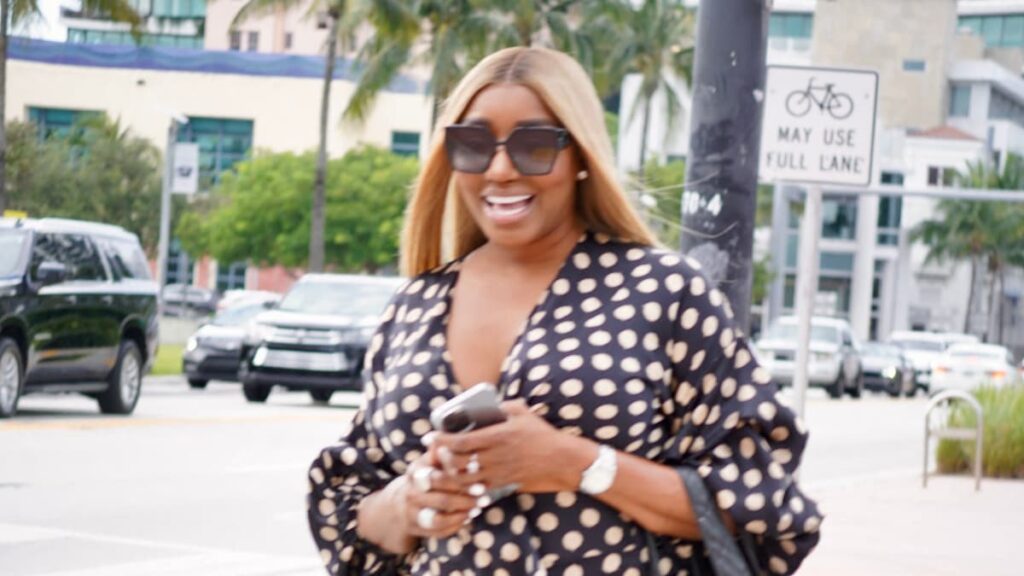 NeNe Leakes Says She’s Open To Returning To Real Housewives of Atlanta After Cynthia Erivo Praise: ‘Why Not?’ NeNe Leakes smiling in the middle of the street with a polka dot outfit.