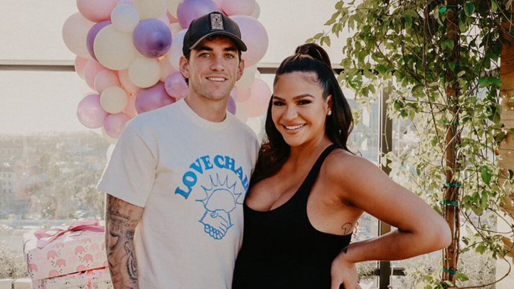 Cassie posing with her husband Alex Fine