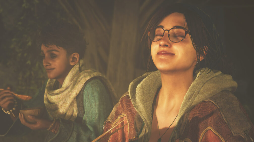 Is There Split-Screen in Monster Hunter Wilds? Two friends sit together in camp in Monster Hunter Wilds