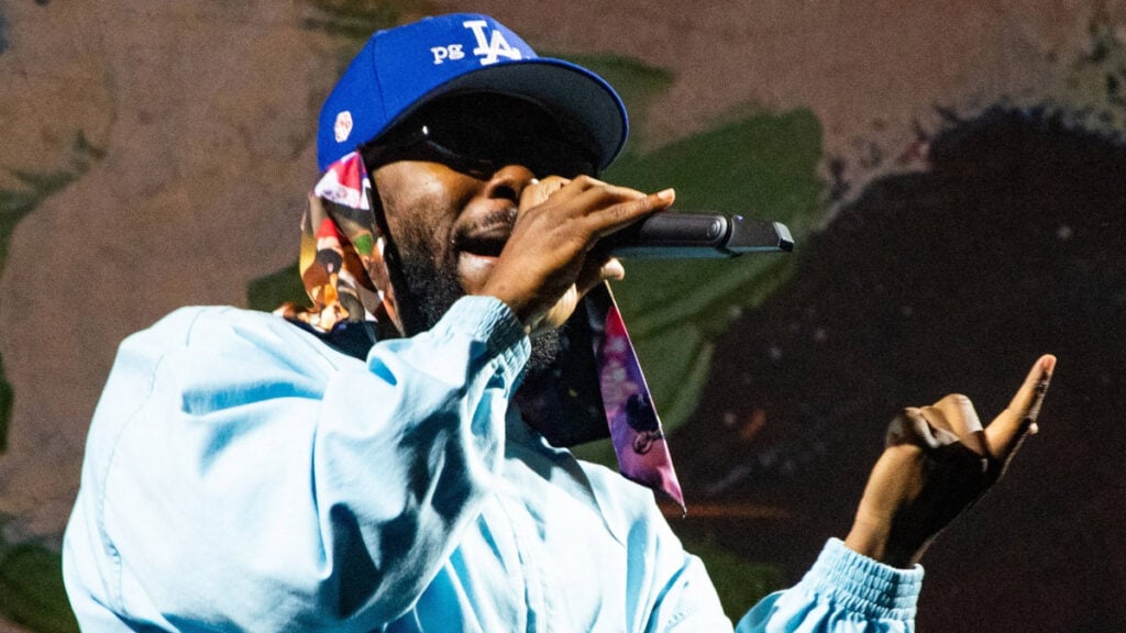 Photo of Kendrick Lamar performing at the Super Bowl LIX amid Drake beef.