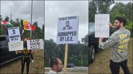 Protestors hold signs denouncing the abductions by ICE and the treatment of those at the Krome Detention Facility in Miami