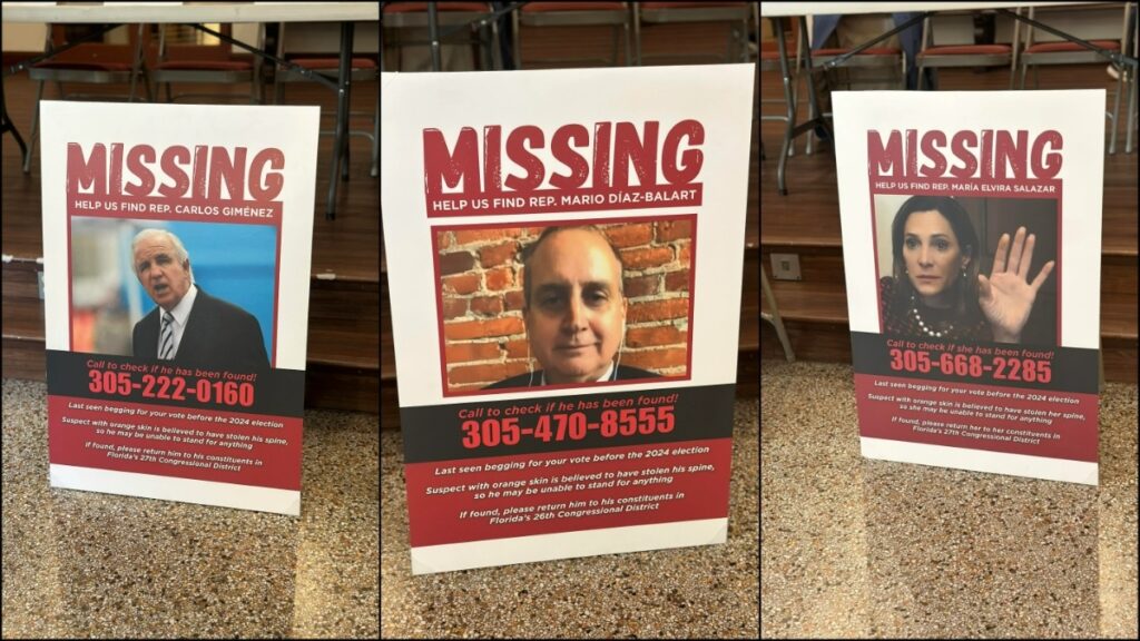 Miami Residents Attend Empty Chair Town Hall as Representatives Hide From Public: ‘Grifters. All Three Of Them’ Prop missing persons posters depict the Miami Representatives dodging the empty town hall event