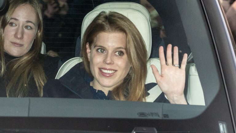 Princess Beatrice waves to cameras