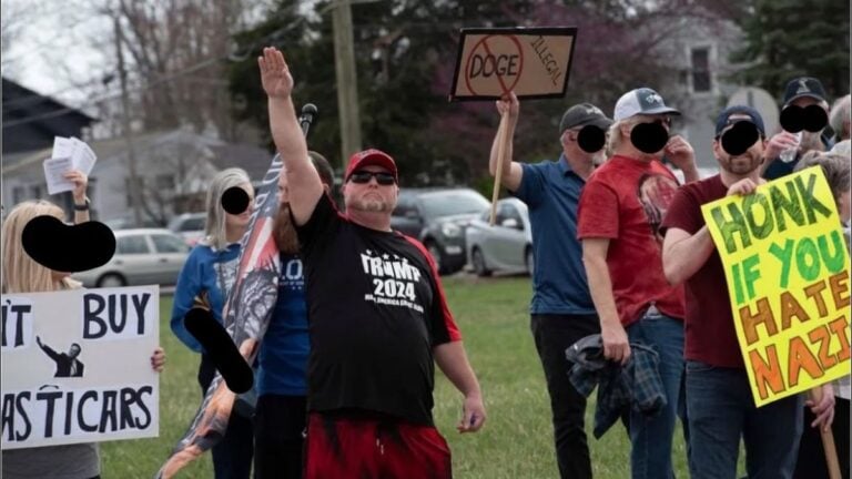 MAGA Man Storms Ohio Anti-Tesla Protest To Make Nazi Salute