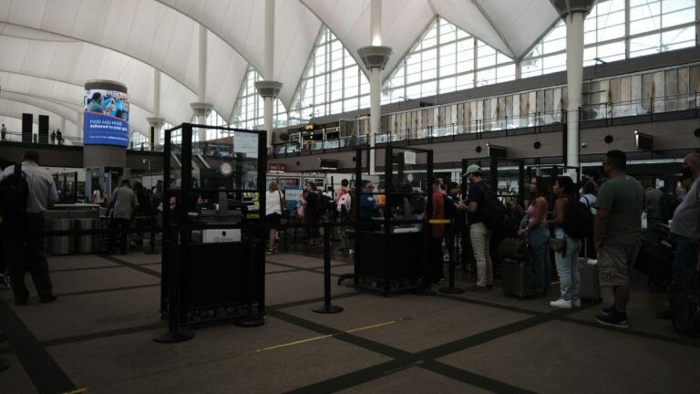 People going through airport security