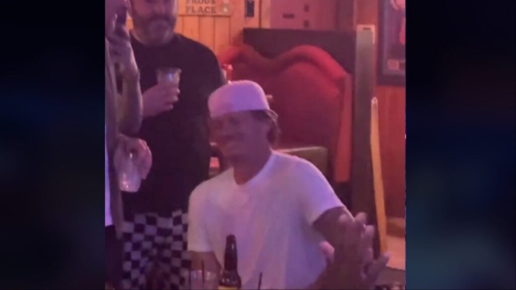 Tom DeLonge watches a fan preform his song in a California bar