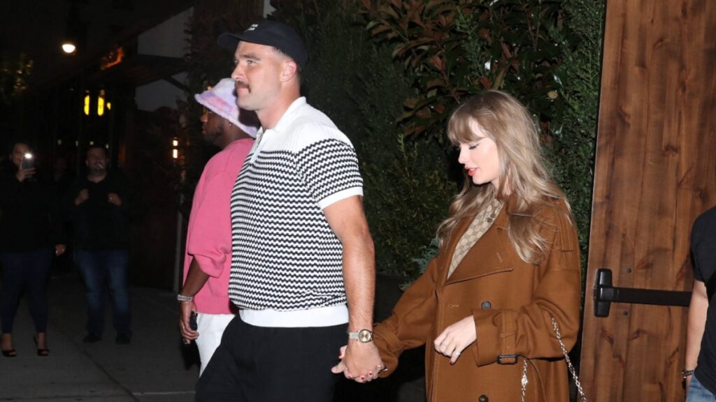 Taylor Swift and Travis Kelce ‘Taking a Break’ as He Focuses on Football Career: They’re Not ‘The Center of Attention Anymore’ Taylor Swift and Travis Kelce holding hands