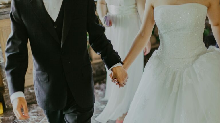 Woman Attends ‘Unorganized Disaster’ Wedding in Washington, ‘Literally Had a Nightmare Similar to This Scenario the Other Night’ a man and woman holding hands, at a wedding