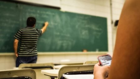 A picture of a teacher in a classroom in relation to the Utah teacher.