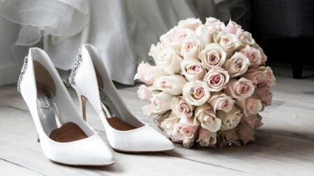 wedding shoes and bouquet of flowers on ground