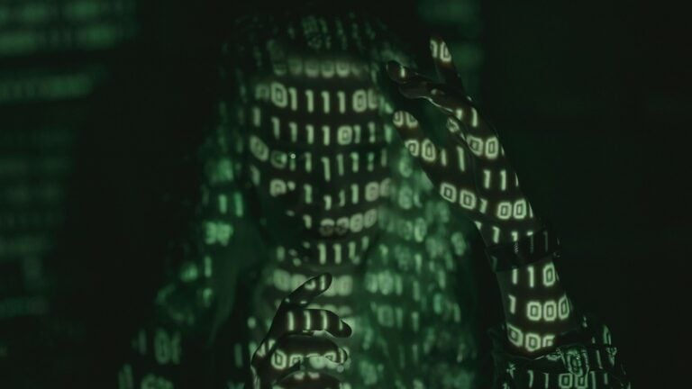 a person being lit by binary code