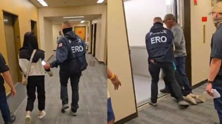 A picture of the Seattle woman being dragged away.