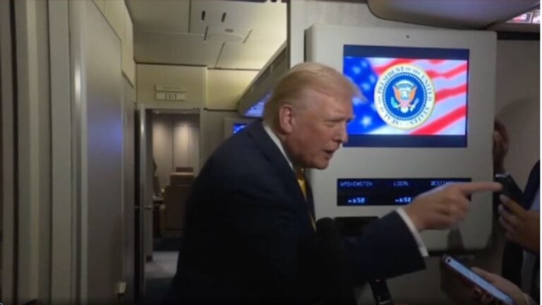 trump speaking to reporter aboard air force one
